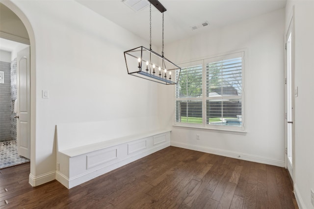3612 Green Mountain Pl, Mckinney, TX 75070 - unfurnished dining area featuring dark wood-type flooring, a chandelier, and arched walkways