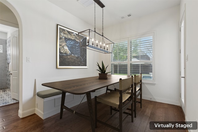 3612 Green Mountain Pl, Mckinney, TX 75070 - dining space featuring wood finished floors, arched walkways, baseboards, and a chandelier
