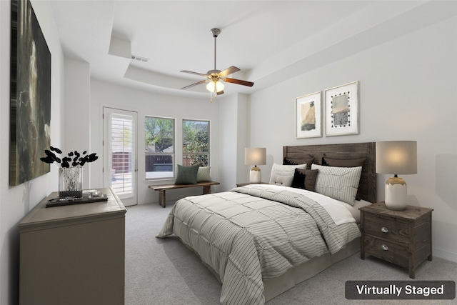 3612 Green Mountain Pl, Mckinney, TX 75070 - bedroom featuring light colored carpet, access to exterior, a tray ceiling, and ceiling fan