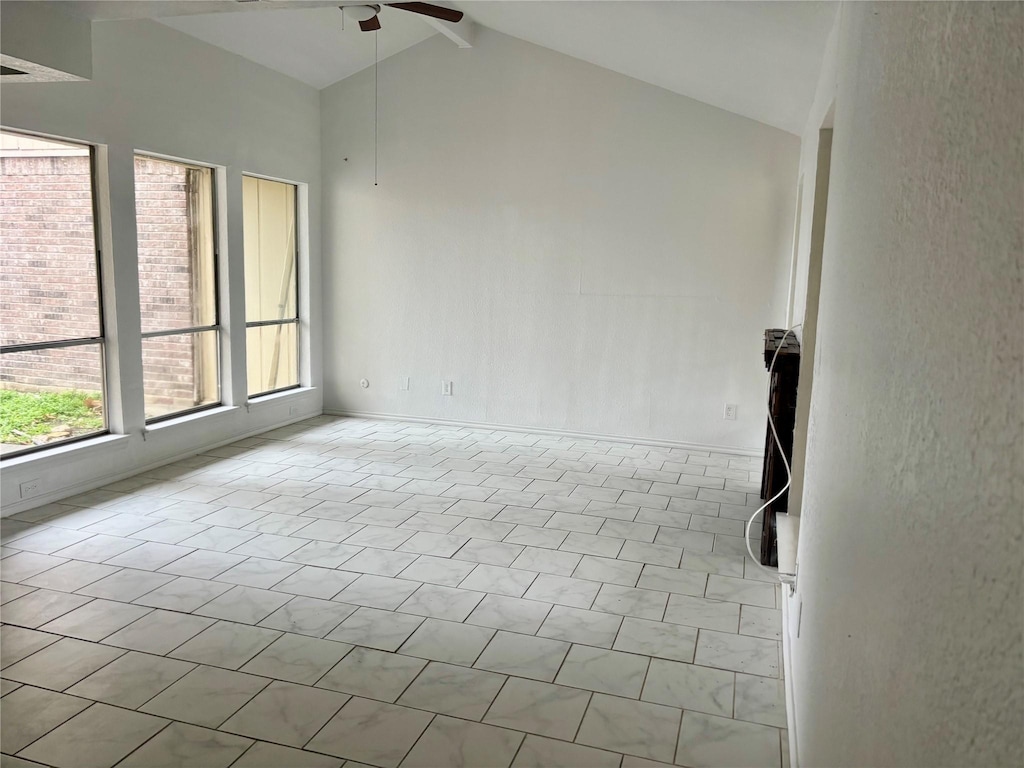 empty room with high vaulted ceiling, beamed ceiling, and a ceiling fan