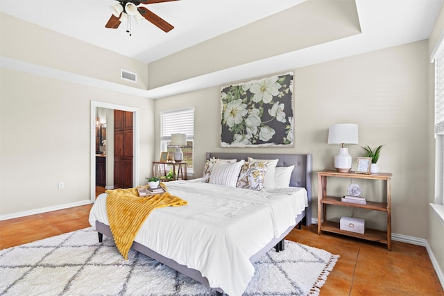2357 S Branch Rd, Krum, TX 76249 - tiled bedroom with connected bathroom and a ceiling fan