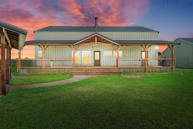 2357 S Branch Rd, Krum, TX 76249 - rear view of house featuring board and batten siding, a metal roof, and covered porch
