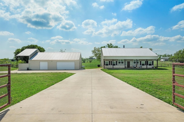 view of front of house featuring a front yard, a garage, and fence