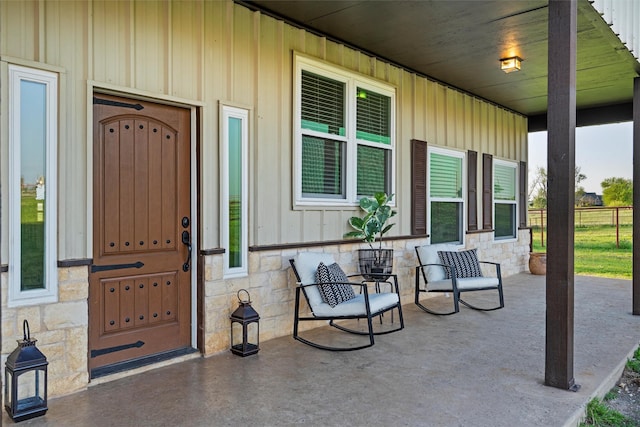 doorway to property featuring stone siding