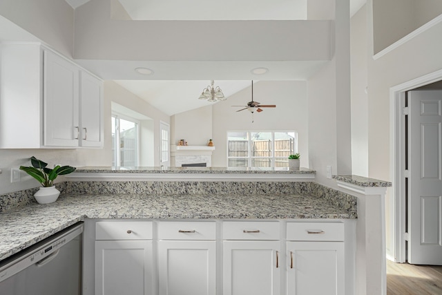 632 Albrook Dr, Allen, TX 75002 - kitchen with stainless steel dishwasher, white cabinets, healthy amount of natural light, lofted ceiling, and light stone counters