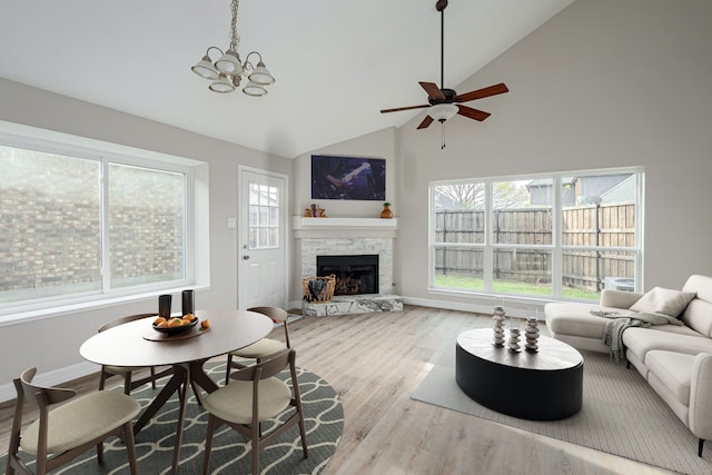 632 Albrook Dr, Allen, TX 75002 - living room featuring wood finished floors, high vaulted ceiling, a fireplace, ceiling fan, and a chandelier