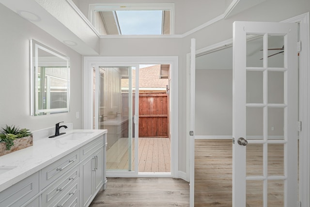 632 Albrook Dr, Allen, TX 75002 - bathroom with double vanity, wood finished floors, and walk in shower