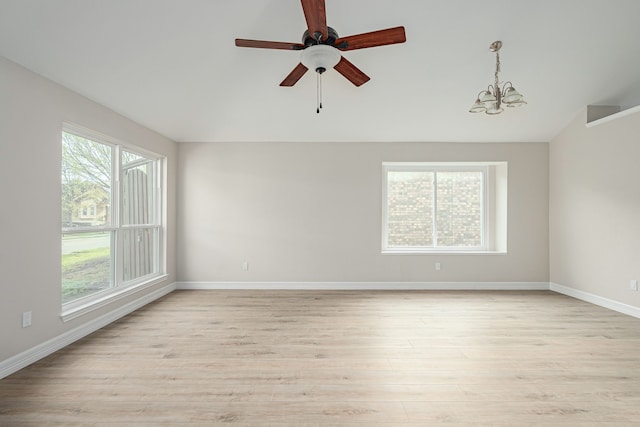 632 Albrook Dr, Allen, TX 75002 - empty room with light wood finished floors, baseboards, a chandelier, a ceiling fan, and lofted ceiling