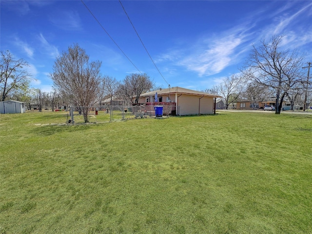 1700 4th St, Brownwood, TX 76801 - view of yard featuring a storage shed, an outbuilding, and fence