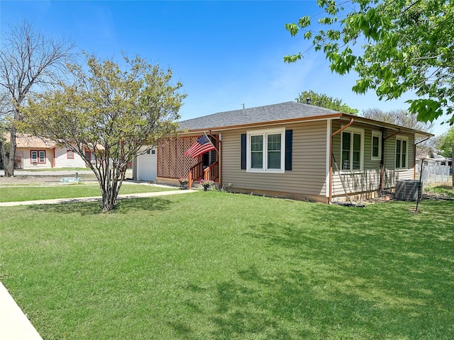 1700 4th St, Brownwood, TX 76801 - ranch-style house with a garage, central air condition unit, and a front lawn