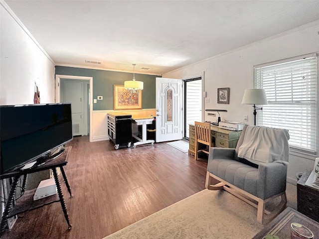 1700 4th St, Brownwood, TX 76801 - living area with an inviting chandelier, visible vents, crown molding, and dark wood finished floors