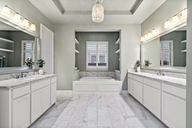 3510 Springbell St, Celina, TX 75009 - bathroom with marble finish floors, a tray ceiling, built in shelves, and two vanities