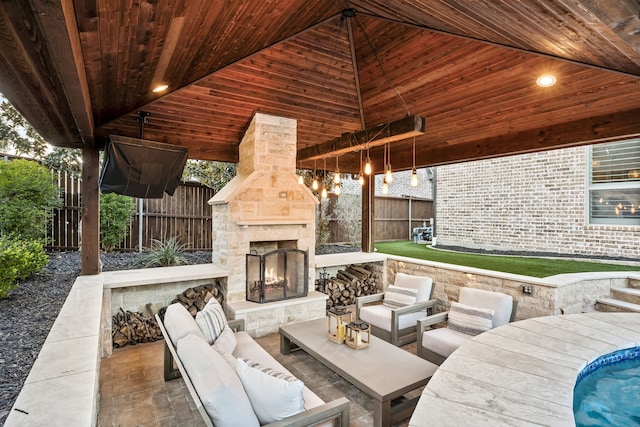 3510 Springbell St, Celina, TX 75009 - fenced backyard with an outdoor living space with a fireplace and a patio area