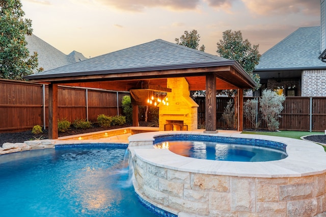 3510 Springbell St, Celina, TX 75009 - view of swimming pool with a gazebo, a fenced backyard, a warm lit fireplace, and a pool with connected hot tub