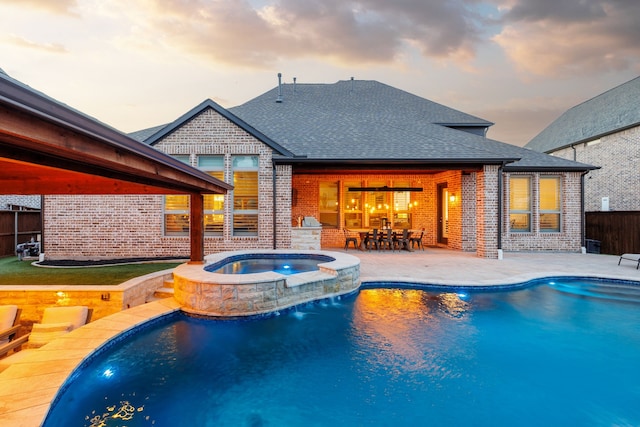 3510 Springbell St, Celina, TX 75009 - pool at dusk with a patio area, outdoor dining space, and a pool with connected hot tub