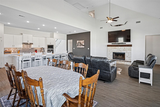 dining area featuring recessed lighting, stairway, ceiling fan, dark wood-style floors, and visible vents