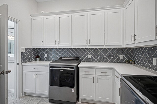 197 Spanish Moss Trl, Rhome, TX 76078 - laundry room with washer / dryer and cabinet space