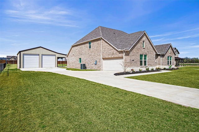 197 Spanish Moss Trl, Rhome, TX 76078 - french country inspired facade with brick siding, a shingled roof, an outdoor structure, and a detached garage