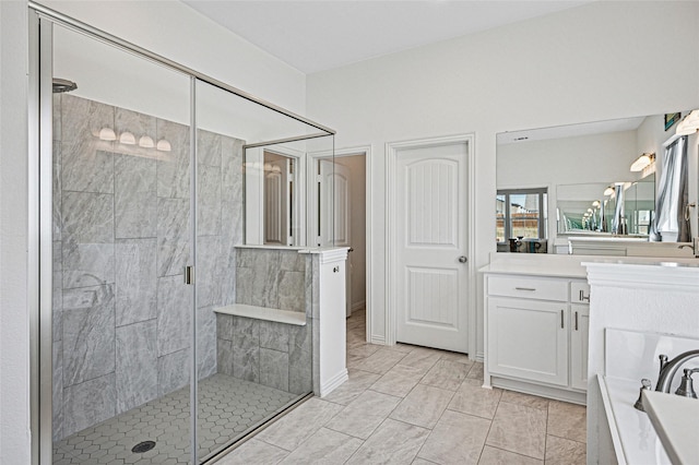 bathroom with vanity and a stall shower