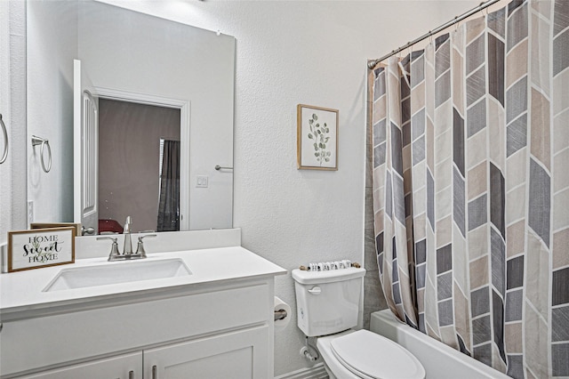 full bathroom with toilet, shower / tub combo, a textured wall, and vanity