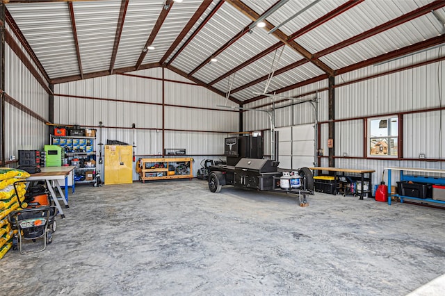 garage featuring a workshop area and metal wall