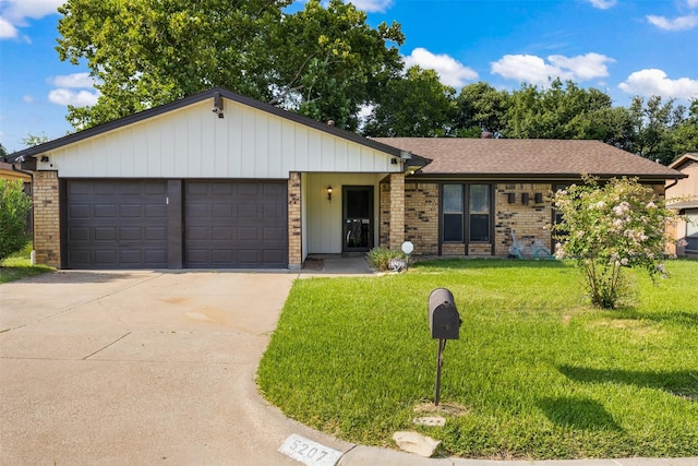 5207 Atlantis Ter, Arlington, TX 76016 - ranch-style house with brick siding, a garage, concrete driveway, a front lawn, and roof with shingles