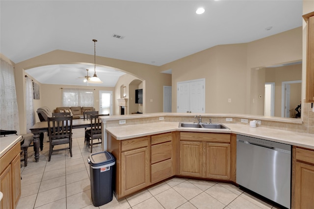 724 Darlington Trl, Fort Worth, TX 76131 - kitchen with stainless steel dishwasher, a sink, arched walkways, light tile patterned floors, and vaulted ceiling