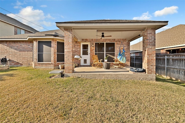 724 Darlington Trl, Fort Worth, TX 76131 - back of property featuring a ceiling fan, a patio area, and brick siding