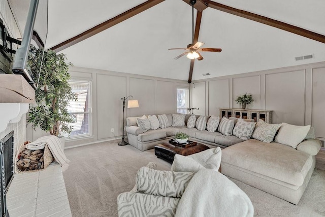 3509 Appalachian Ct, Plano, TX 75075 - living area featuring a decorative wall, carpet flooring, a ceiling fan, beam ceiling, and a brick fireplace