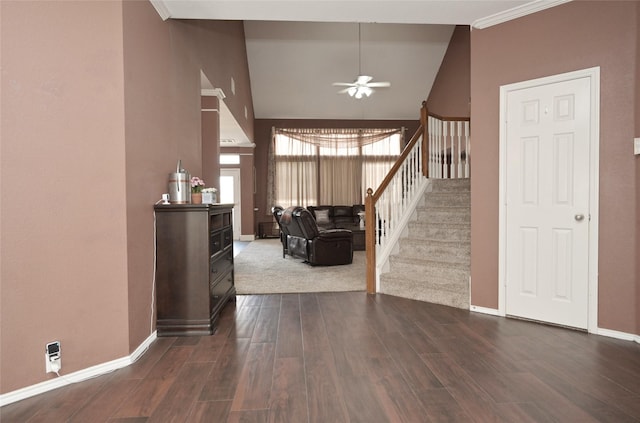 entryway with lofted ceiling, ceiling fan, baseboards, stairs, and dark wood-style flooring