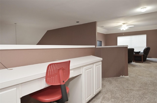 office with vaulted ceiling, light colored carpet, and ceiling fan