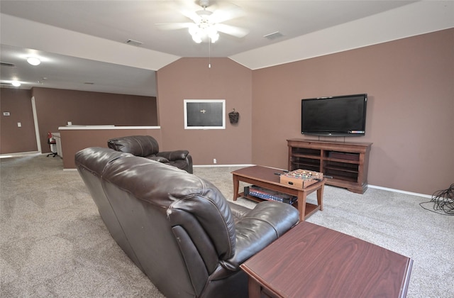 carpeted living area with vaulted ceiling, a ceiling fan, visible vents, and baseboards