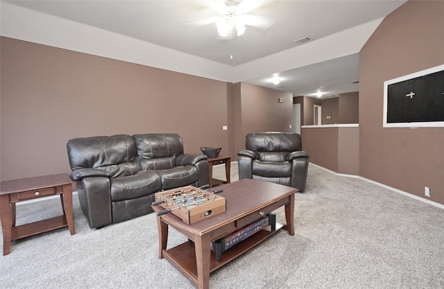 living area with ceiling fan, baseboards, visible vents, and carpet