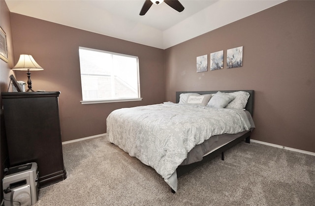 bedroom featuring ceiling fan, baseboards, lofted ceiling, and carpet