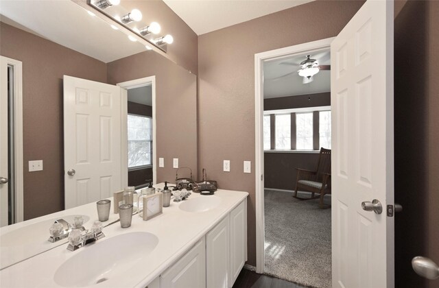 full bathroom featuring plenty of natural light, a sink, and ceiling fan