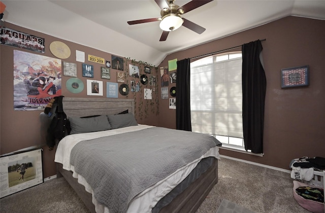 carpeted bedroom with lofted ceiling, a ceiling fan, baseboards, and multiple windows