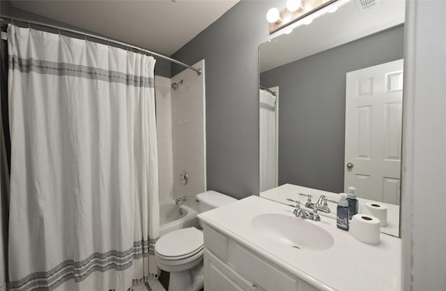 bathroom featuring visible vents, shower / bath combo with shower curtain, vanity, and toilet