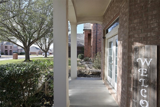 view of patio / terrace with french doors and a residential view