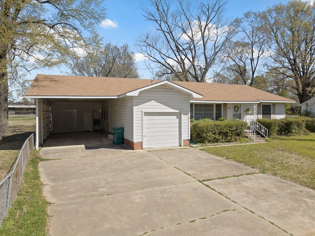 609 E Main, Omaha, TX 75571 - view of front facade featuring fence, driveway, a front lawn, an attached carport, and a garage