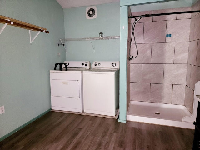 laundry room with visible vents, baseboards, laundry area, dark wood finished floors, and separate washer and dryer