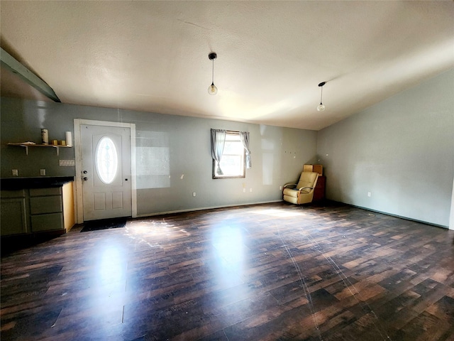 foyer entrance featuring dark wood-style flooring