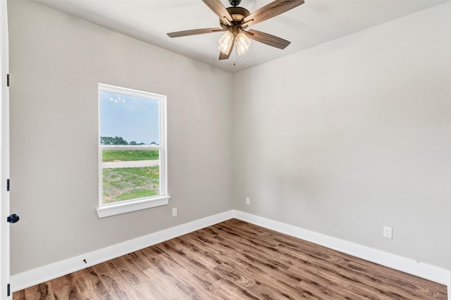 309 Pecan Ln, Tolar, TX 76476 - empty room featuring wood finished floors, baseboards, and a ceiling fan
