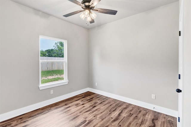 309 Pecan Ln, Tolar, TX 76476 - spare room featuring wood finished floors, baseboards, and a ceiling fan