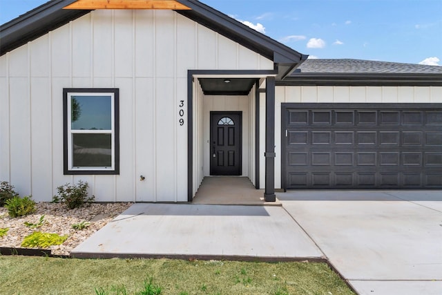 309 Pecan Ln, Tolar, TX 76476 - entrance to property featuring a garage, board and batten siding, and driveway