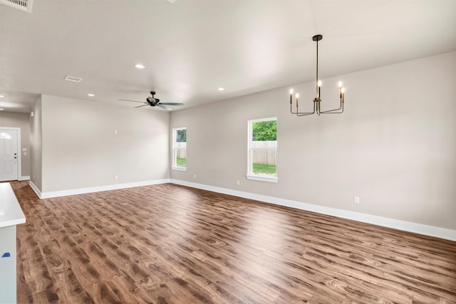 309 Pecan Ln, Tolar, TX 76476 - unfurnished living room with wood finished floors, a chandelier, recessed lighting, and baseboards
