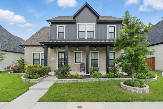 2205 Sandrellan St, Fort Worth, TX 76008 - view of front of house featuring a porch, a standing seam roof, board and batten siding, and stone siding