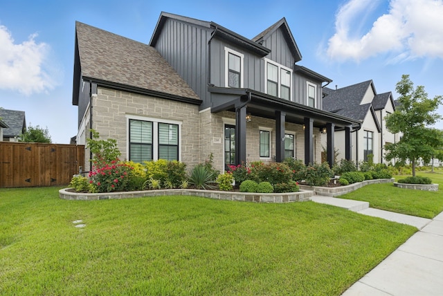 2205 Sandrellan St, Fort Worth, TX 76008 - view of front of house featuring board and batten siding, a shingled roof, and stone siding