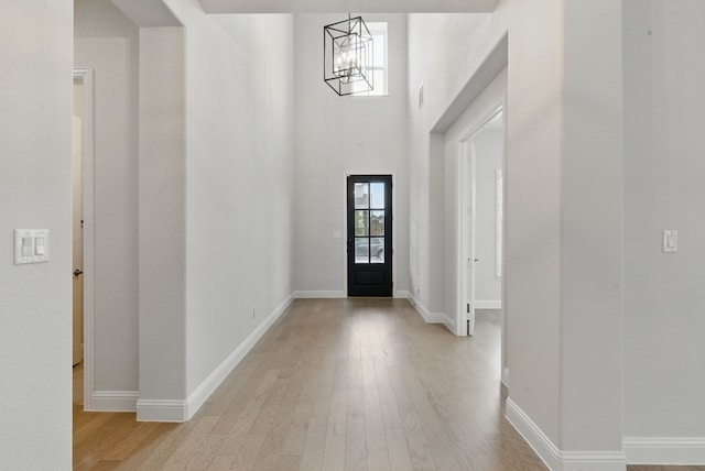 2205 Sandrellan St, Fort Worth, TX 76008 - entryway with a chandelier, light wood-style flooring, and baseboards