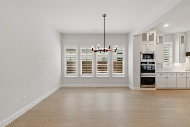 2205 Sandrellan St, Fort Worth, TX 76008 - kitchen featuring appliances with stainless steel finishes, healthy amount of natural light, light wood-type flooring, and recessed lighting