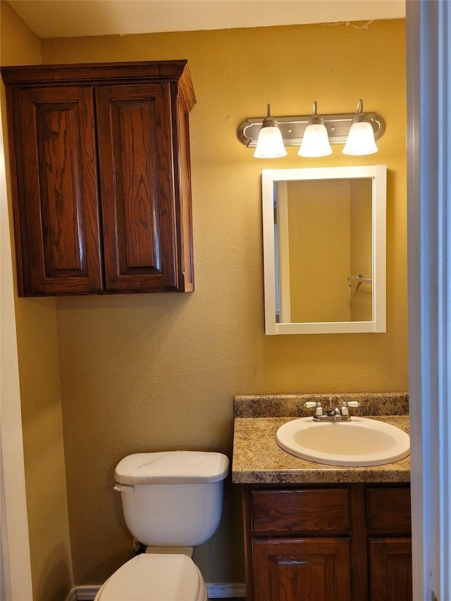 half bath with toilet and vanity